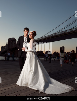 Bride and groom. Romantic style under the Brooklyn Bridge. Stock Photo