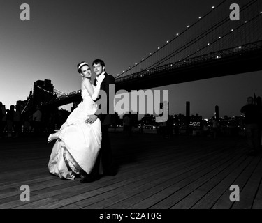 Bride and groom. Romantic style under the Brooklyn Bridge. Stock Photo