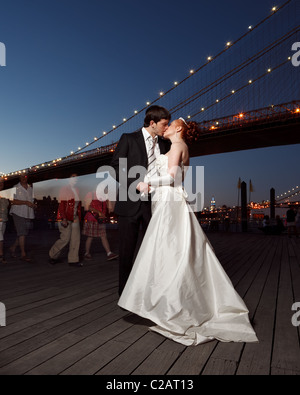 Bride and groom. Romantic style under the Brooklyn Bridge. Stock Photo