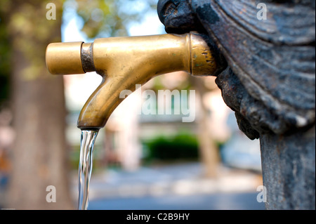 A public water fountain faucet Stock Photo