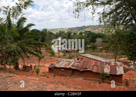 Mud brick house with heavily rusted corrugated iron roof, Kisarwe Village, near Dar es Salaam, Tanzania Stock Photo