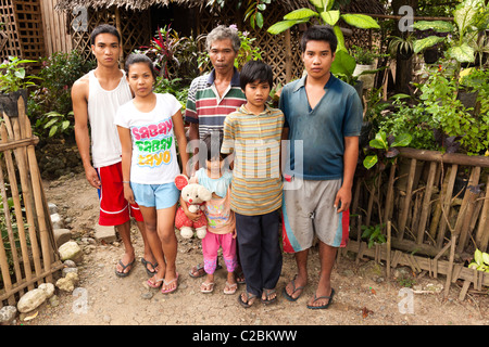 Portrait of a Filipino family outside their house. Iloilo the ...