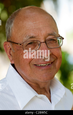 Portrait of a smiling older gentleman wearing spectacles Stock Photo