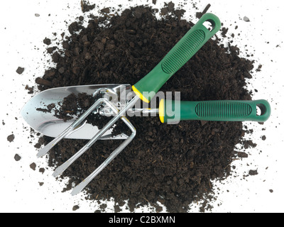 Garden soil and implements isolated against a white background Stock Photo