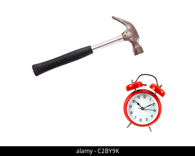 An alarm clock and a hammer isolated against a white background Stock Photo
