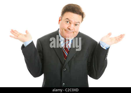 Mature businessman shrugs in an indifferent way. Isolated on white.  Stock Photo