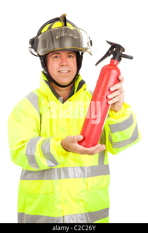 Fire fighter demonstrating how to use a fire extinguisher. Isolated on white.  Stock Photo