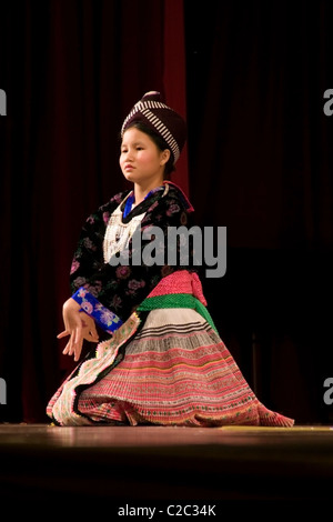 A disabled woman dancer with a hearing impairment (deaf) is wearing a traditional costume at a stage show in Vientiane, Laos. Stock Photo