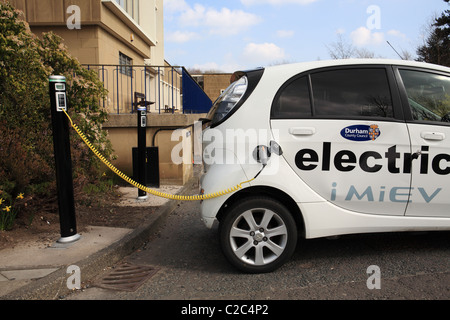 Charging a Mitsubishi iMiEV electric car at Durham County Hall, NE England Stock Photo