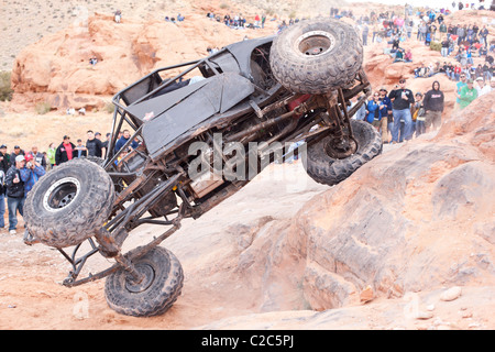 Rollover on the slick sandstone. The area surrounding Moab in Southeastern Utah is a paradise for off-roaders. Grand County, Utah, USA. Stock Photo