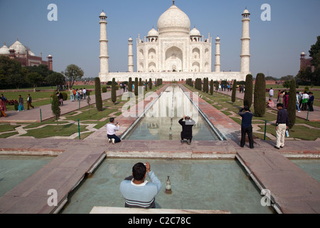 Visitors take photos of Taj Mahal in Agra, India. Stock Photo