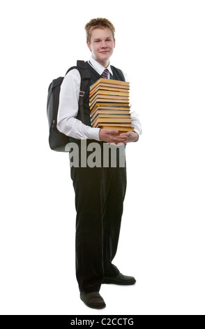 The schoolboy in a school uniform with a huge pack of books Stock Photo