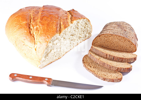 Half of a big white bread loaf and sliced loaf of rye bread with knife isolated on white background Stock Photo