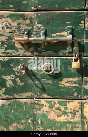 Bolt and lock on a green door, Venice, Italy Stock Photo