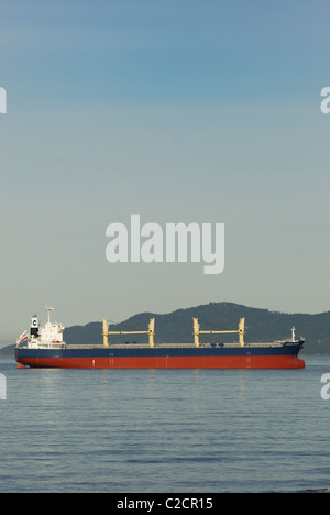 Cargo freighter Clipper Phoenix anchored out in Burrard Inlet, Vancouver British Columbia Stock Photo