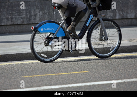Part of a female cyclist cycling on a Boris Bike in London, England Stock Photo
