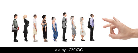Full length portrait of men and women standing in a line with a hand about to push them Stock Photo
