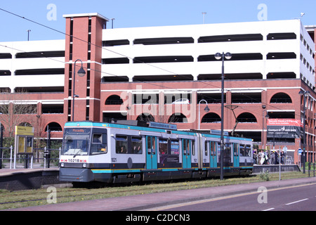 Metrolink tram arriving at Harbour City tram stop en route to Piccadilly from Eccles. Stock Photo