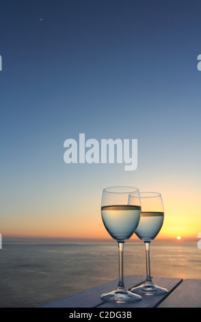 Two glasses of wine by the ocean Stock Photo