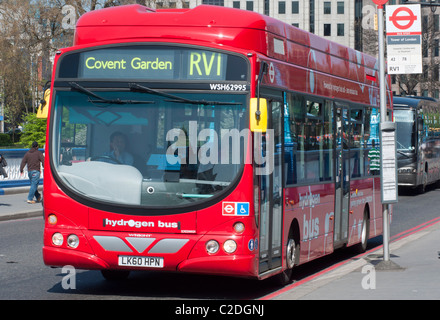 A hydrogen powered bus in London with Tower Bridge reflecting in the windscreen, England. Stock Photo