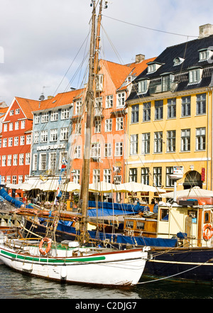 Traditional waterfront gabled houses and wooden sailing boats Nyhavn (New Harbor) Copenhagen Denmark Scandinavia Stock Photo
