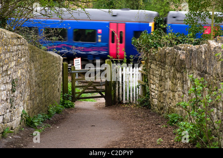 Train going through an unattended crossing Bradford on Avon Wiltshire England UK Stock Photo