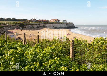 Holiday-makers enjoying some early April sunshine on the blue flag beach at Joss Bay on the Kent coast. Stock Photo