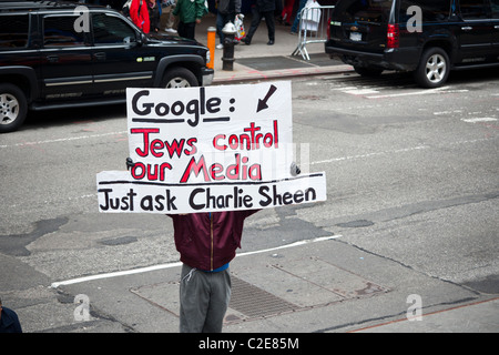 A demonstrator in Times Square in New York on Thursday, April 7, 2011 holds up an anti-semitic sign Stock Photo