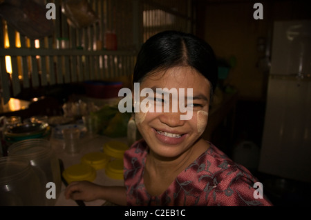 Pyay, Burma - Portrait of a Burmese girl with traditional tanaka make up working in one of the town restaurant. Stock Photo