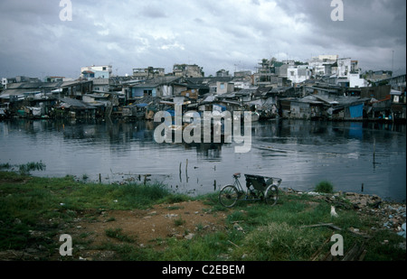 Ho Chi Minh City is the largest city in Vietnam and is located near the Mekong River delta. Slums are common along the side of Stock Photo