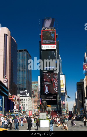 Northern side Two Times Square electronic billboard building with blue sky background, Manhattan, New York City, USA Stock Photo