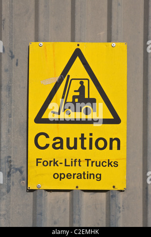 11.4.2011 Caution Fork-Lift Trucks operating warning sign. Stock Photo