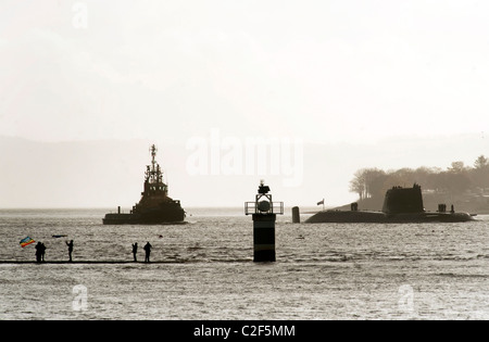 HMS Astute, the Royal Navy's latest nuclear submarine sail up Gareloch on the Firth of Cylde to her new base at HMNB Faslane. Stock Photo