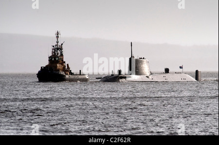 HMS Astute, the Royal Navy's latest nuclear submarine sail up Gareloch on the Firth of Cylde to her new base at HMNB Faslane. Stock Photo