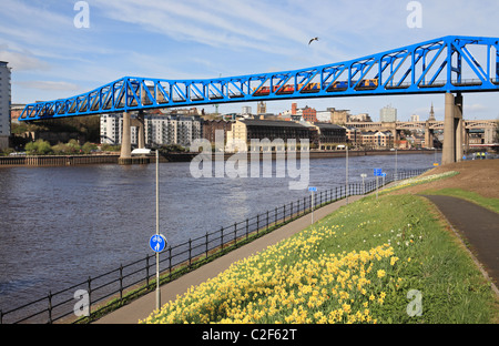 A Tyne and Wear Metro train crosses the river Tyne between Gateshead and Newcastle, north east England, UK Stock Photo