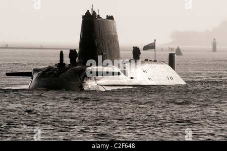 HMS Astute, the Royal Navy's latest nuclear submarine sail up Gareloch on the Firth of Cylde to her new base at HMNB Faslane. Stock Photo