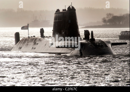 HMS Astute, the Royal Navy's latest nuclear submarine sail up Gareloch on the Firth of Cylde to her new base at HMNB Faslane. Stock Photo