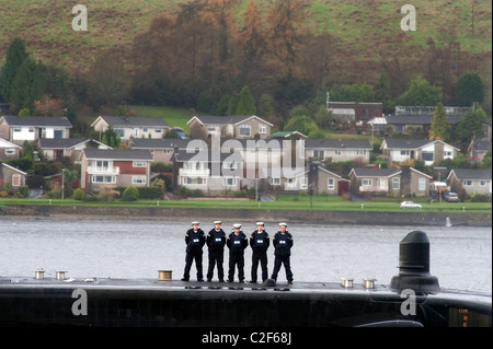 HMS Astute, the Royal Navy's latest nuclear submarine sail up Gareloch on the Firth of Cylde to her new base at HMNB Faslane. Stock Photo