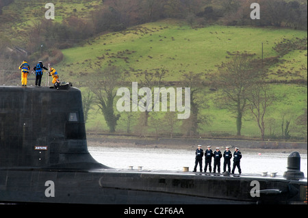 HMS Astute, the Royal Navy's latest nuclear submarine sail up Gareloch on the Firth of Cylde to her new base at HMNB Faslane. Stock Photo