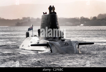 HMS Astute, the Royal Navy's latest nuclear submarine sail up Gareloch on the Firth of Cylde to her new base at HMNB Faslane. Stock Photo