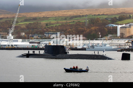 HMS Astute, the Royal Navy's latest nuclear submarine sail up Gareloch on the Firth of Cylde to her new base at HMNB Faslane. Stock Photo