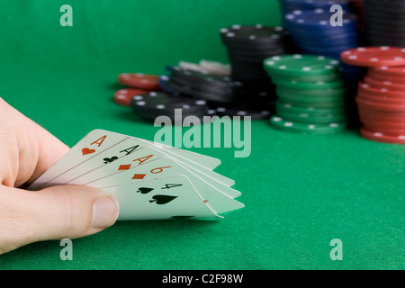 A poker hand with three of a kind Aces Stock Photo