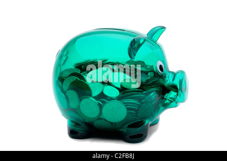 Green Plastic See Through Piggy Bank Full Of Canadian Coins Stock Photo