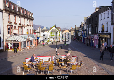 Keswick, Cumbria, England, UK. An outdoor cafe in quiet pedestrian street on Sunday morning in the town centre Stock Photo