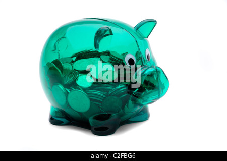 Green Plastic See Through Piggy Bank Full Of Canadian Coins Stock Photo