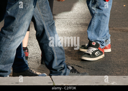 group of teenagers shoes standing in street Stock Photo