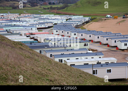 Mobile caravan site, static caravan park, at West Bay, Dorset UK in January - static caravans mobile homes Stock Photo