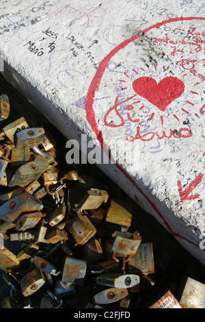 red love heart graffiti and love locks on the milvio bridge in rome, italy Stock Photo