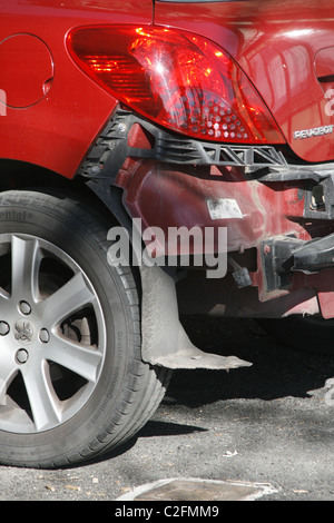 detail of crash accident damage to red peugeot car Stock Photo