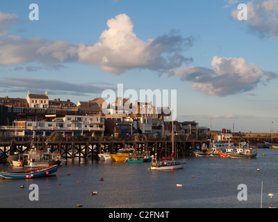 Bridlington town seen from across the Harbour in evening light Stock Photo